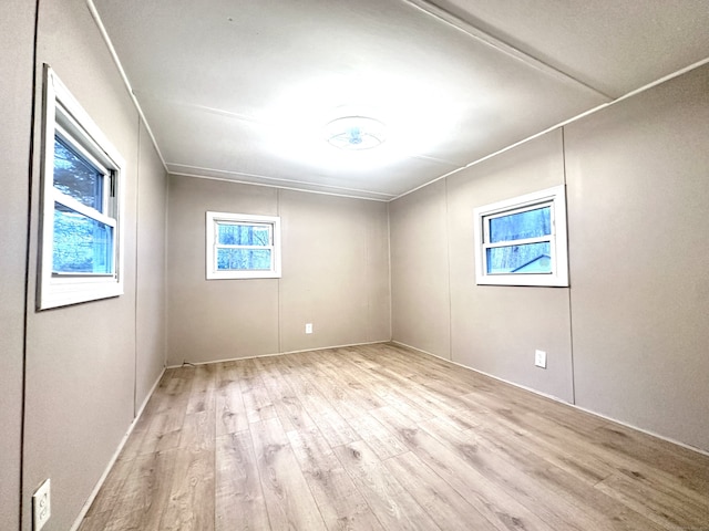 spare room featuring light wood-type flooring