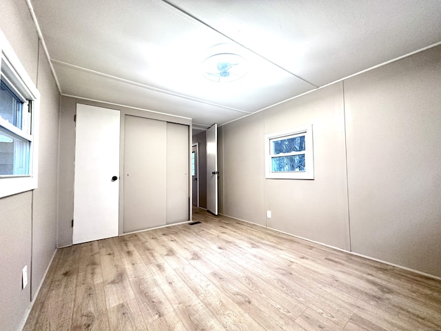 unfurnished bedroom featuring light hardwood / wood-style floors