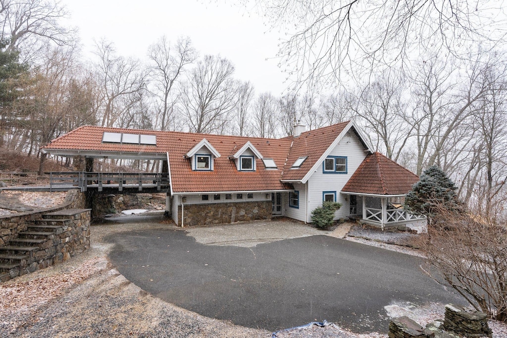 view of front of home with a wooden deck and a garage