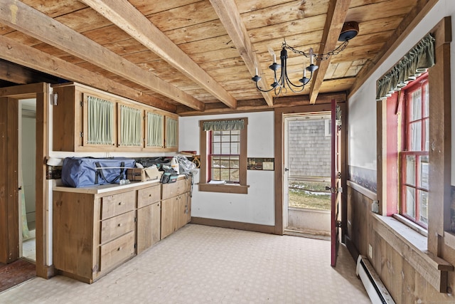 interior space with wooden ceiling, a baseboard radiator, beamed ceiling, and a notable chandelier