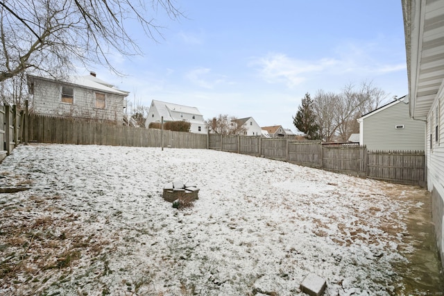 view of yard layered in snow