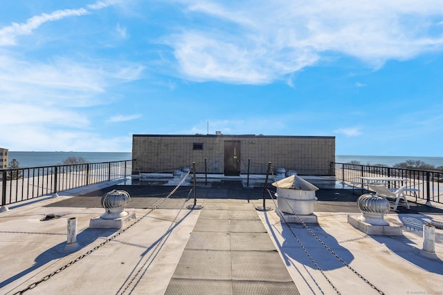 view of patio / terrace featuring a water view