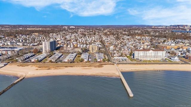 birds eye view of property with a view of the beach and a water view