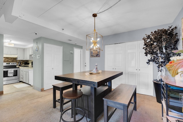 view of carpeted dining space