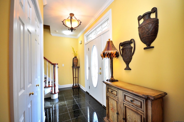 foyer entrance featuring crown molding