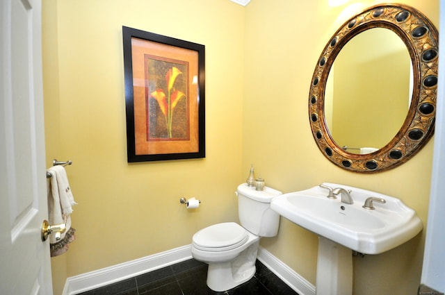 bathroom featuring tile patterned floors and toilet