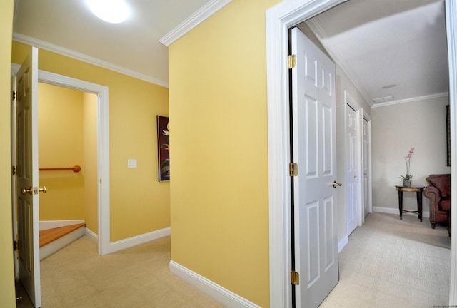 corridor featuring light carpet and crown molding