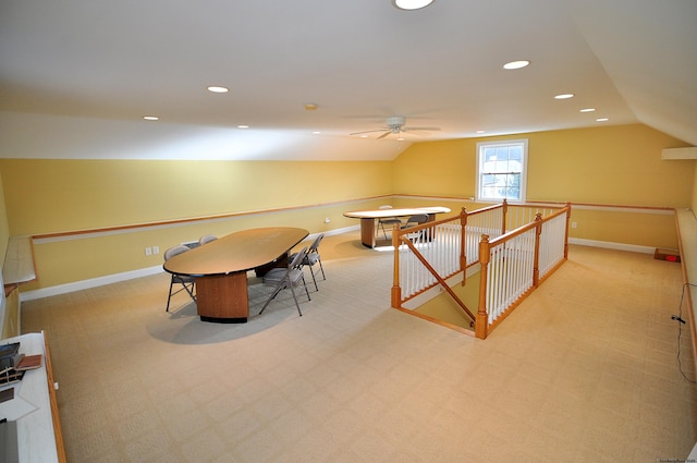 playroom with lofted ceiling and light colored carpet