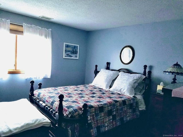 bedroom with a textured ceiling