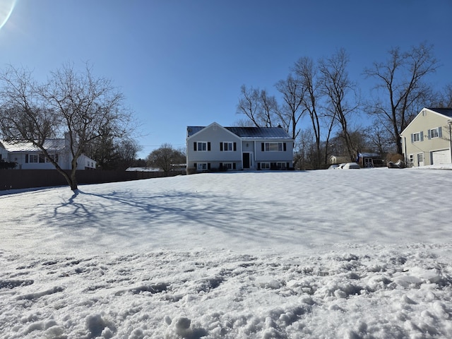 view of yard layered in snow