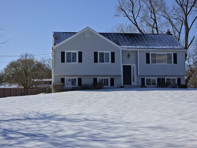 bi-level home featuring fence