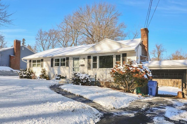 single story home featuring a carport