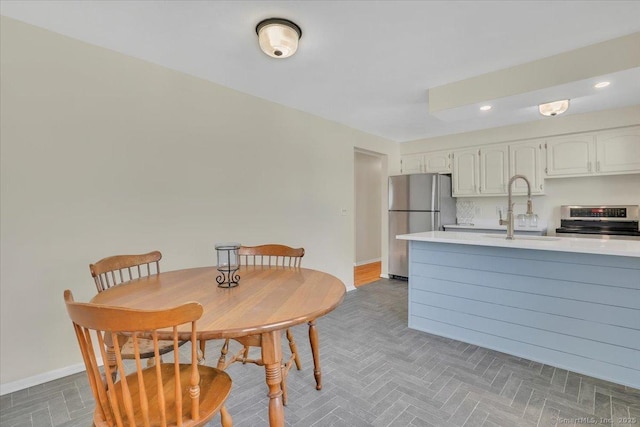 dining area featuring sink