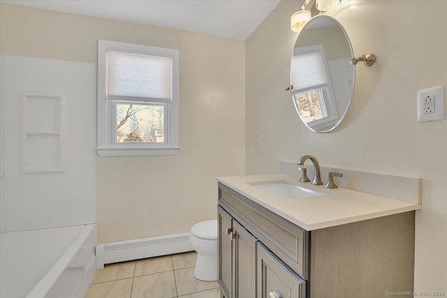 bathroom with a washtub, baseboard heating, tile patterned flooring, vanity, and toilet