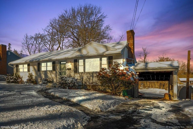 view of front of house with a carport