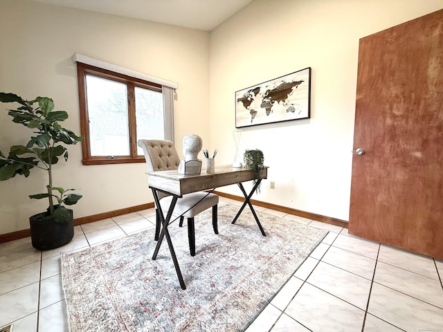 tiled home office featuring lofted ceiling