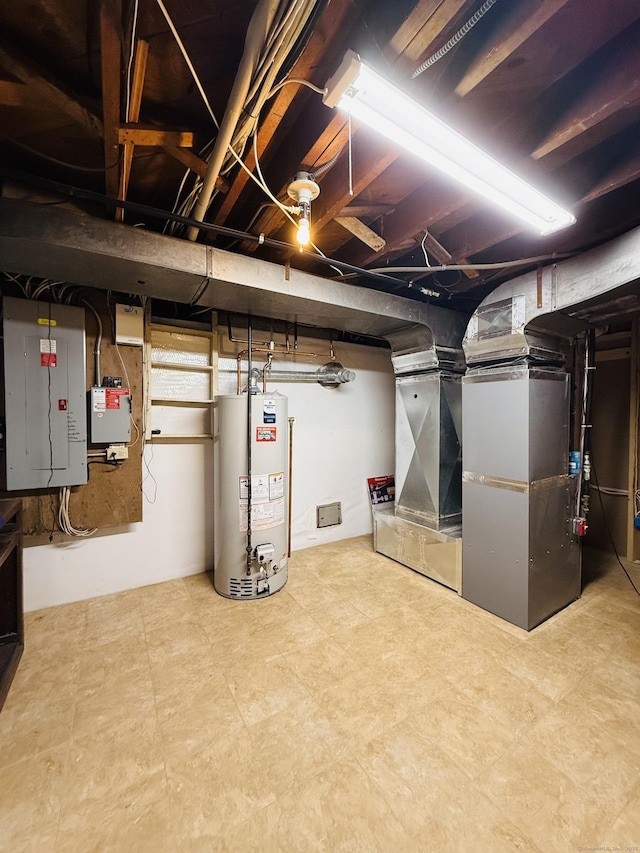 basement featuring electric panel and gas water heater