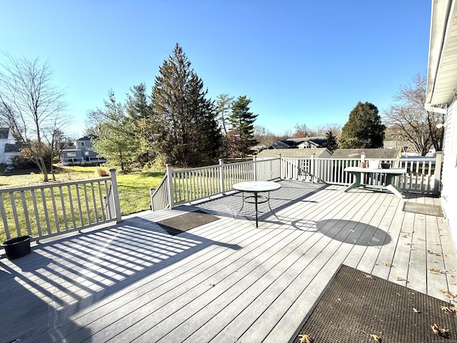 wooden deck with a yard