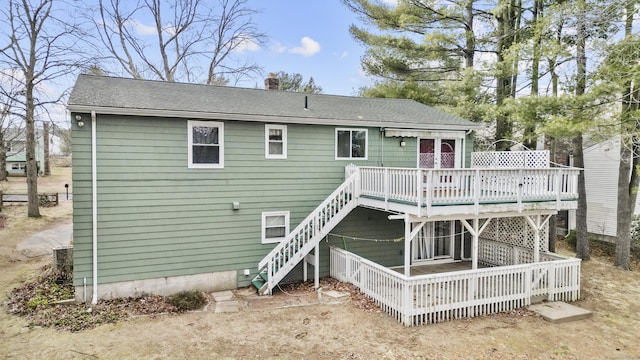 rear view of property featuring a deck