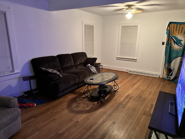 living room with ceiling fan, wood-type flooring, and a baseboard radiator