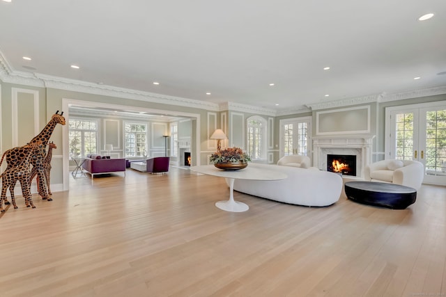 4 Cowdray Park Dr, Greenwich, CT 06831 - living area with a wealth of natural light, light wood-style flooring, and a high end fireplace