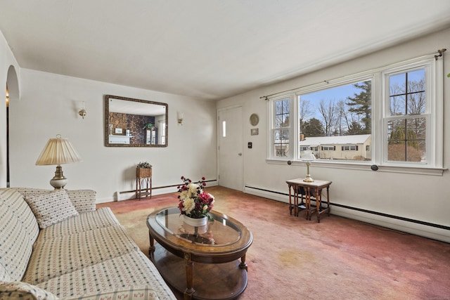 carpeted living room featuring a baseboard heating unit