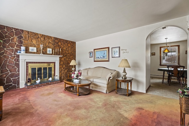 carpeted living room featuring a fireplace