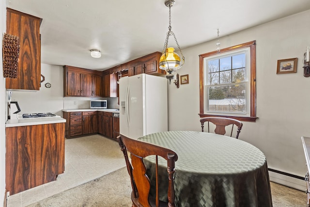 dining area with a baseboard heating unit