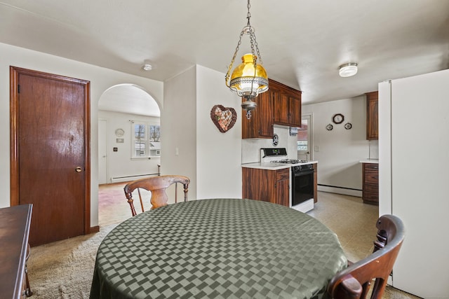 dining space with a baseboard heating unit