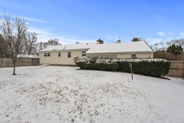 view of snow covered house