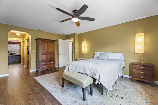 bedroom with dark wood-type flooring and ceiling fan