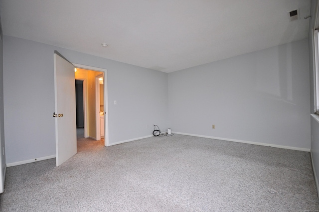 spare room featuring carpet floors