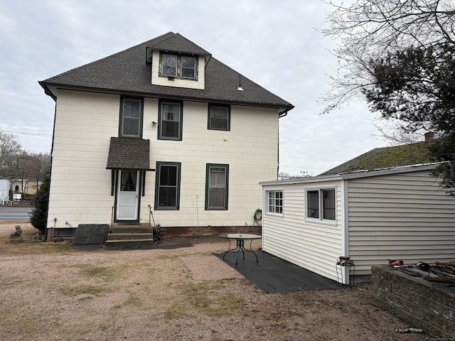 rear view of house with a patio