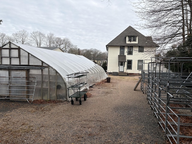 exterior space with an outbuilding