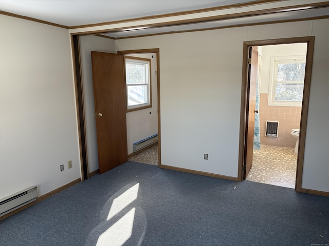 unfurnished bedroom featuring a baseboard heating unit, dark colored carpet, and ornamental molding