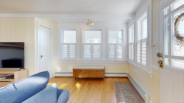 sunroom / solarium with a baseboard radiator