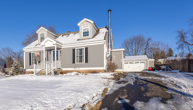 new england style home with a garage