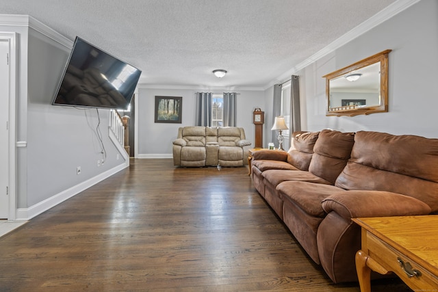 living room featuring ornamental molding, dark hardwood / wood-style floors, and a textured ceiling