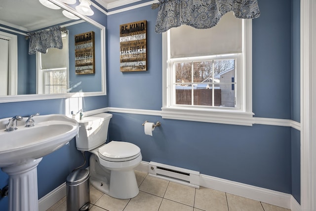 bathroom with a baseboard radiator, ornamental molding, tile patterned floors, and toilet