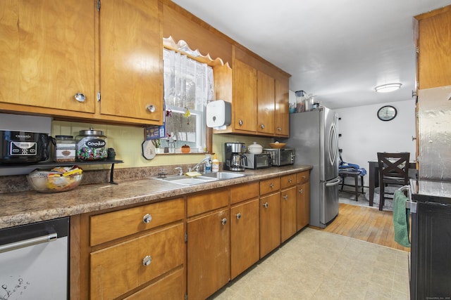 kitchen featuring stainless steel appliances and sink