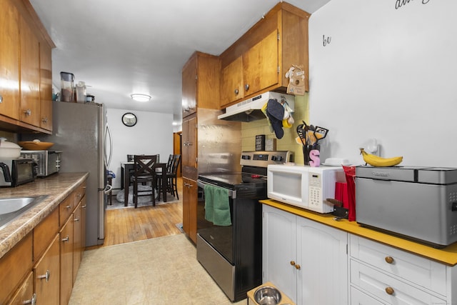 kitchen featuring stainless steel electric range oven