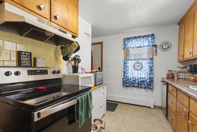 kitchen featuring stainless steel appliances, tasteful backsplash, a baseboard heating unit, and sink