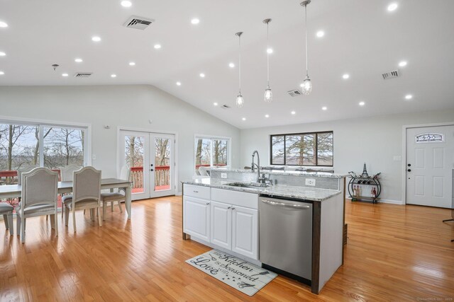 12 Willowledge Cir, Waterbury, CT 06704 - kitchen with french doors, sink, stainless steel dishwasher, pendant lighting, and white cabinets