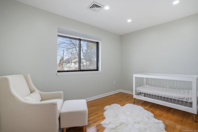 12 Willowledge Cir, Waterbury, CT 06704 - bedroom featuring a crib and wood-type flooring