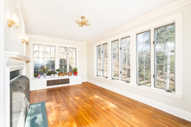 unfurnished sunroom featuring visible vents and a fireplace