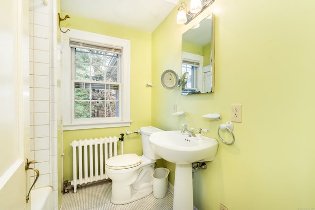 full bathroom featuring tile patterned flooring, toilet, plenty of natural light, and radiator heating unit