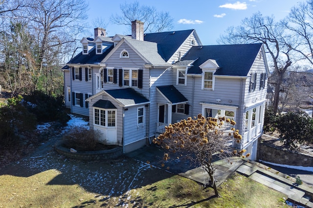 rear view of house with a chimney