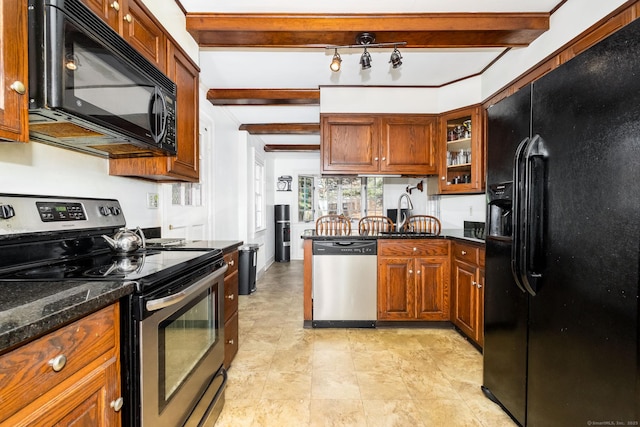 kitchen featuring a sink, black appliances, brown cabinets, and beamed ceiling