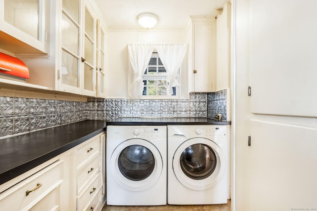 laundry room with cabinet space and washing machine and clothes dryer