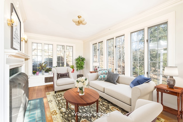 sunroom featuring a fireplace and visible vents